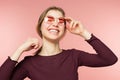 Woman smiling with perfect smile and white teeth on the pink studio background Royalty Free Stock Photo