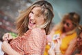 Woman smiling while playing cads with firends Royalty Free Stock Photo