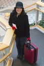 Woman smiling ready to board a plane