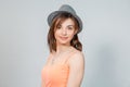 Cute teenager girl with hat  smiling shy looking at you camera Royalty Free Stock Photo