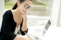 Woman smiling and writing in notepad Royalty Free Stock Photo