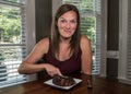Woman Smirking At Camera While Pulling Chocolate Cake