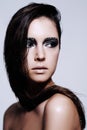 Woman, smokey and eyes with makeup in studio for art and beauty, thinking and wondering with thoughts for cosmetics Royalty Free Stock Photo