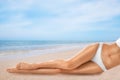 Woman with smooth silky skin after epilation on beach, closeup. Space for text