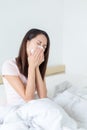 Woman sneeze on bed Royalty Free Stock Photo