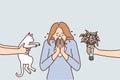 Woman sneezes or experiences rheum due to allergic reaction to cat or flowers Royalty Free Stock Photo