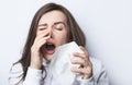 Woman sneezes in a napkin Royalty Free Stock Photo