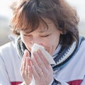 Woman sneezing