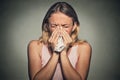 Woman sneezing blowing her runny nose Royalty Free Stock Photo