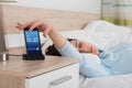 Woman Snoozing Alarm On Mobile Phone Royalty Free Stock Photo