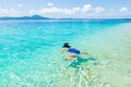 Woman snorkeling in caribbean sea, turquoise blue water, tropical island. Indonesia Banyak Islands Sumatra, tourist diving travel