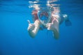 Woman snorkeling showing thumbs. Snorkel in full face mask. Female swim with loose red hair. Royalty Free Stock Photo