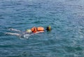 Woman snorkelling in andaman sea at phi phi islands, Thailand