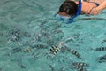 Woman Snorkelling in deep green sea