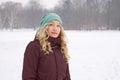 Woman in snow covered park in winter