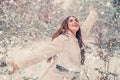 Woman in snow. Enjoying nature wintertime. Vintage winter person. Girl playing with snow in park. Beautiful young woman Royalty Free Stock Photo