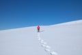 Woman snow-shoeing in the mountains