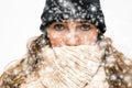 Woman in the Snow with winter wearing, wrapped in winter cap and scarf looking cold isolated on white background Royalty Free Stock Photo