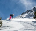 Woman snowboarder in motion in mountains Royalty Free Stock Photo
