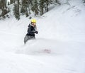 Woman snowboarder in motion in mountains Royalty Free Stock Photo