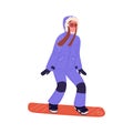 Woman snowboarder sliding down. Snow board rider standing on snowboard. Happy person in winter outfit riding. Extreme