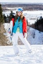 Woman snowboarder on the slopes frosty winter day