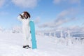 Woman snowboarder on the slopes on a frosty winter day Royalty Free Stock Photo