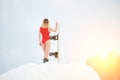 Woman snowboarder with snowboard on snowy slope at winter ski resort