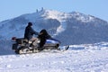 Woman on snowmobile