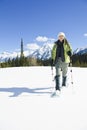 Woman snowshoeing in the Canadian rockies