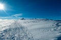 Kor Alps - Woman in snowshoes on the way to majestic summit peak Grosser Speikogel in Kor Alps, Lavanttal Alps