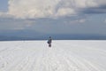 Woman on snowy mountain plateau Royalty Free Stock Photo