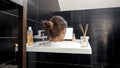 A Woman Soaks in a Relaxing Bath and Browses the Web on Her Tablet Computer. Working at home, modern technology, remote job Royalty Free Stock Photo