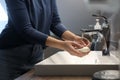 Woman with soap bar washing hands in bathroom, closeup Royalty Free Stock Photo