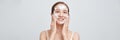 Panorama of asian female applying foamy cosmetic product on face during skincare routine Royalty Free Stock Photo