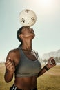 Woman, soccer ball and balance on head in training grass field, sports ground or fitness training club. Football player Royalty Free Stock Photo