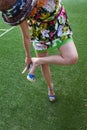 Woman taking off the high heel sandals