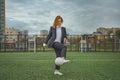 woman soccer player with ball on the field. ball dribbling, feint. Royalty Free Stock Photo