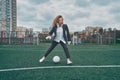 woman soccer player with ball on the field. ball dribbling, feint. Royalty Free Stock Photo