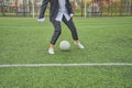 woman soccer player with ball on the field. ball dribbling, feint. Royalty Free Stock Photo