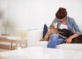 Woman, sofa and happy cuddle with dogs for care, love or bonding in home living room, playing and together. Girl, animal