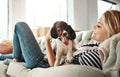 Woman, sofa and holding dog in house, living room and love with care, relax and happy pet friendship. Girl, couch and