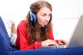 Woman on sofa with laptop