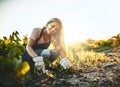 Woman, soil and plants with smile at farm for crops, agriculture and nature for job, food or vegetables. Girl, shovel