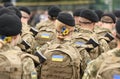 Woman soldier. Woman in army. Ukrainian flag on military uniform. Ukraine troops