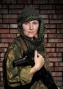 Woman of the soldier with an automatic assault r Royalty Free Stock Photo