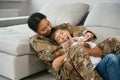 Woman soldier with her beloved son teenager at home