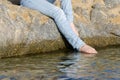 Woman soles touching the sea Royalty Free Stock Photo
