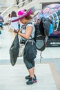 A woman in a sombrero with a large backpack and bags Royalty Free Stock Photo