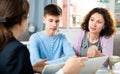 Woman with son meeting with tutor